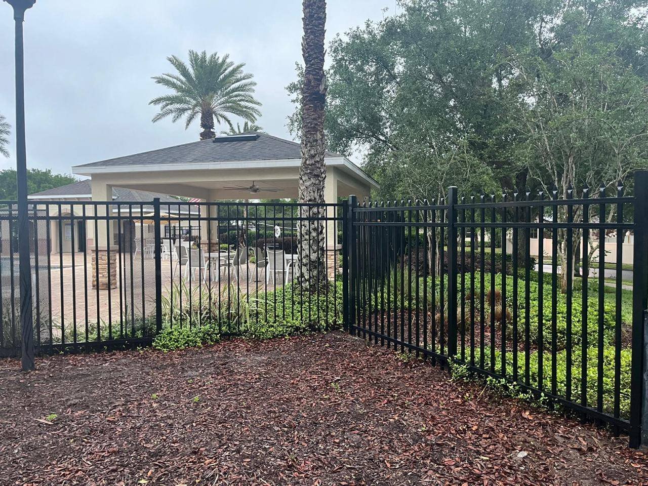 Aluminum pool fence installed near a pool deck in Florida