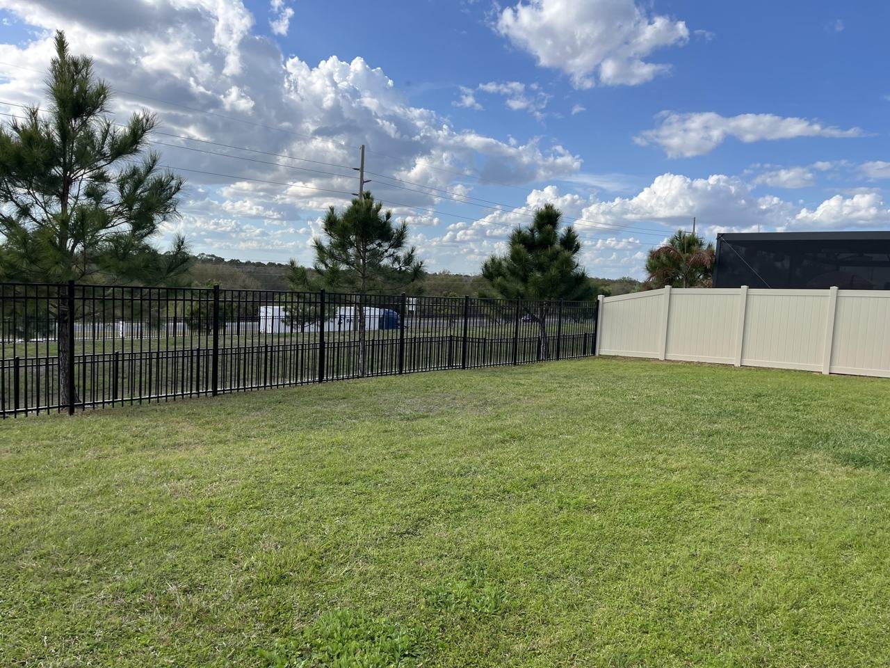 Aluminum and vinyl fences combined on one Orlando property